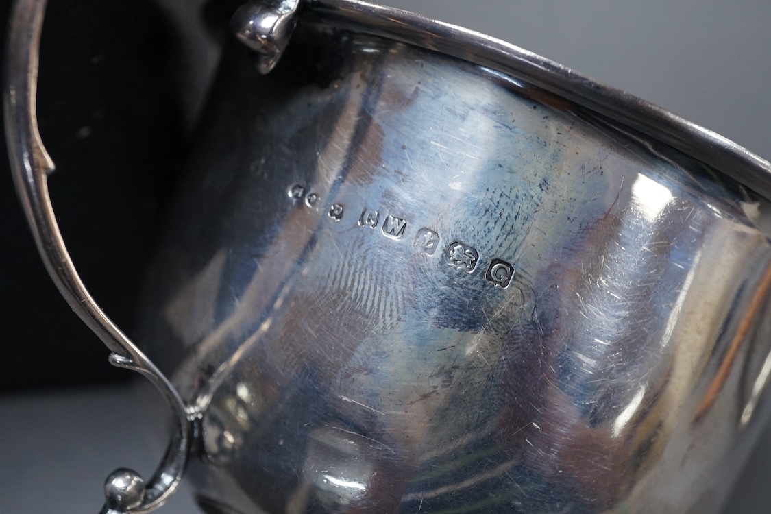 A George III silver octagonal nutmeg grater by Phipps & Robinson, London, 1810, 46mm(a.f.), together with a George III silver pedestal pepperette, by Alice & George Burroughs, London, 1808, 70mm.